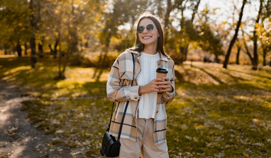 attractive young woman taking a stroll at the park