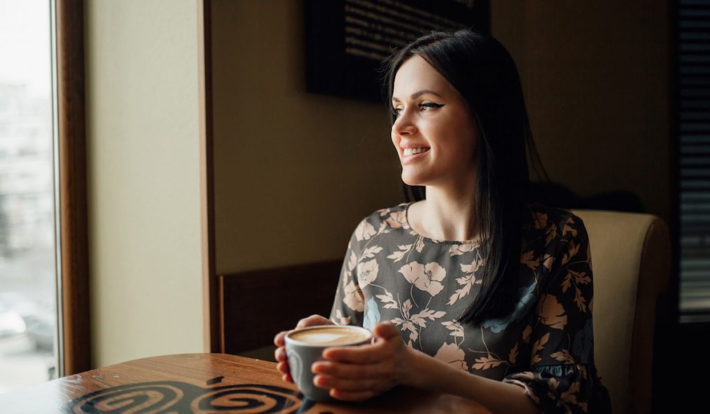 beautiful woman enjoying her coffee